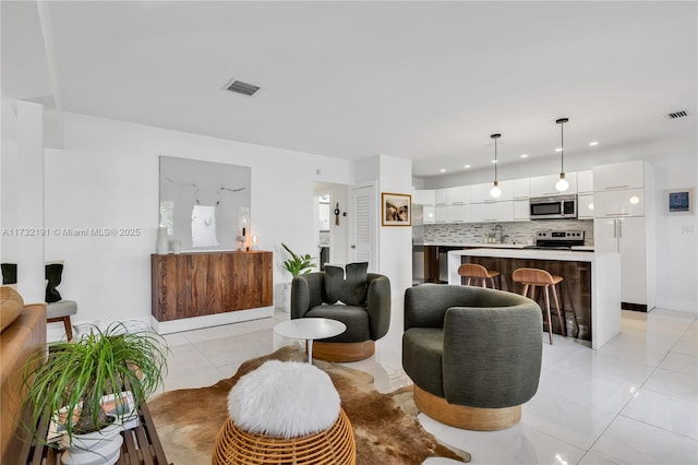 living room featuring light tile patterned floors