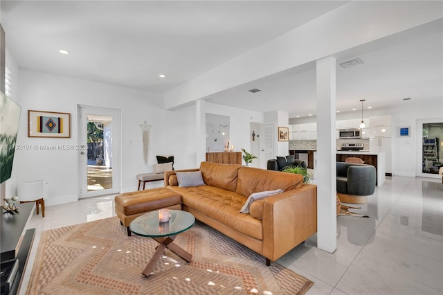 living room with light tile patterned floors