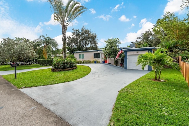 ranch-style house with a garage and a front lawn