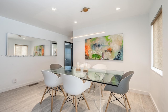 dining space featuring light hardwood / wood-style floors