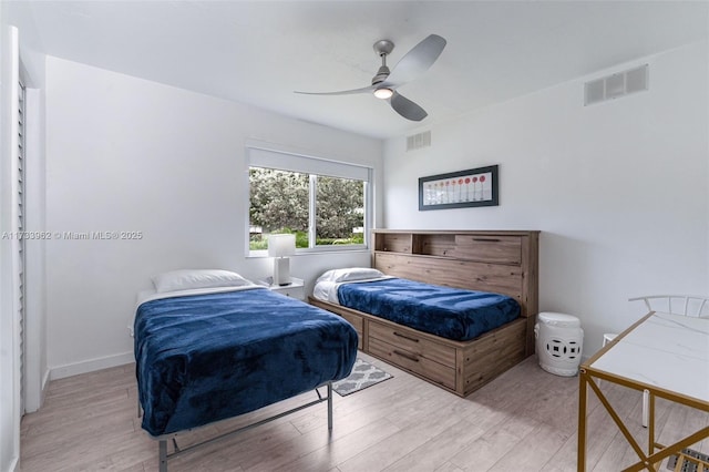 bedroom with light wood-type flooring and ceiling fan