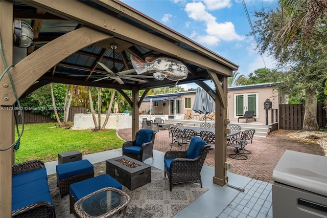 view of patio / terrace with an outbuilding and an outdoor fire pit