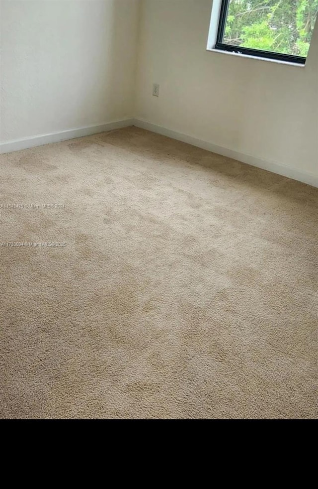 view of carpeted spare room