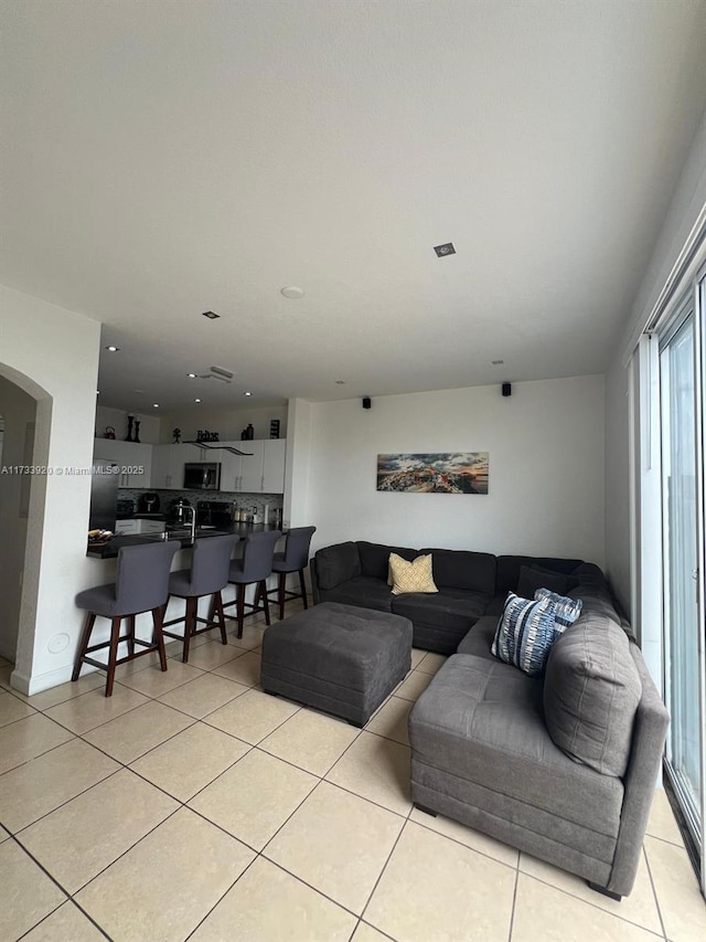 living room featuring light tile patterned flooring