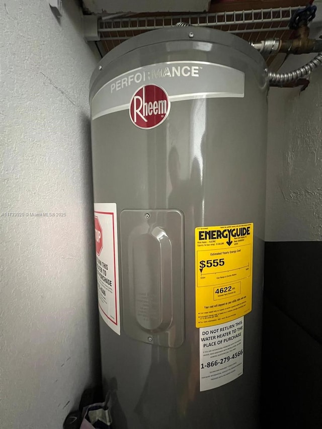 utility room featuring electric water heater