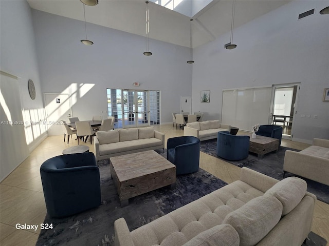 living room with a high ceiling