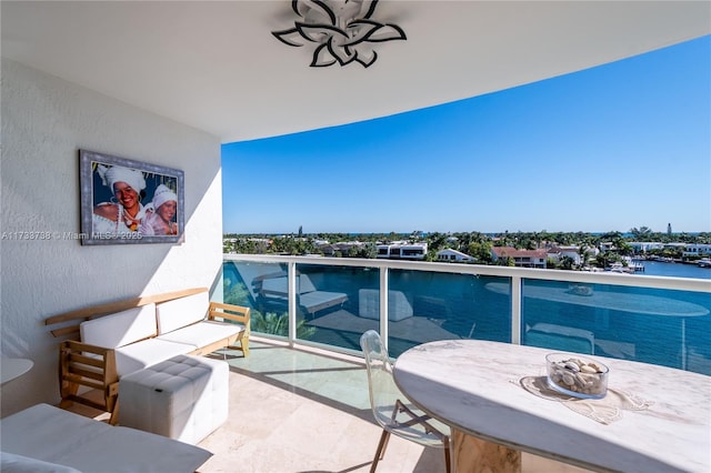 balcony featuring a water view