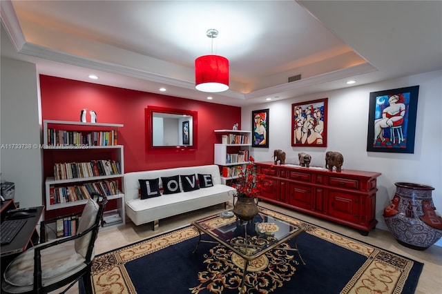 sitting room featuring a raised ceiling