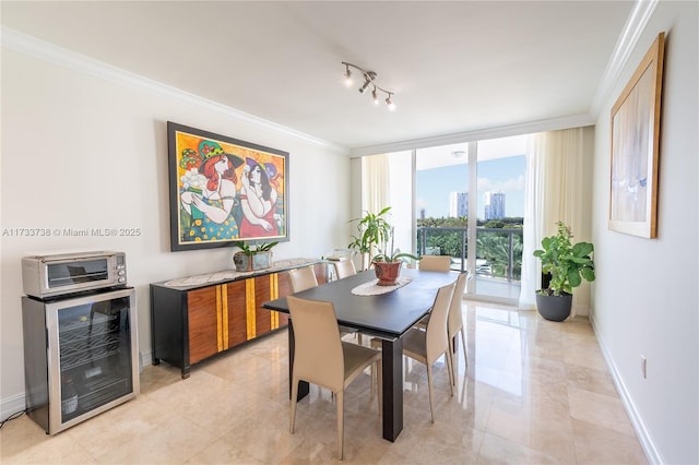 dining area with wine cooler, a wall of windows, and ornamental molding