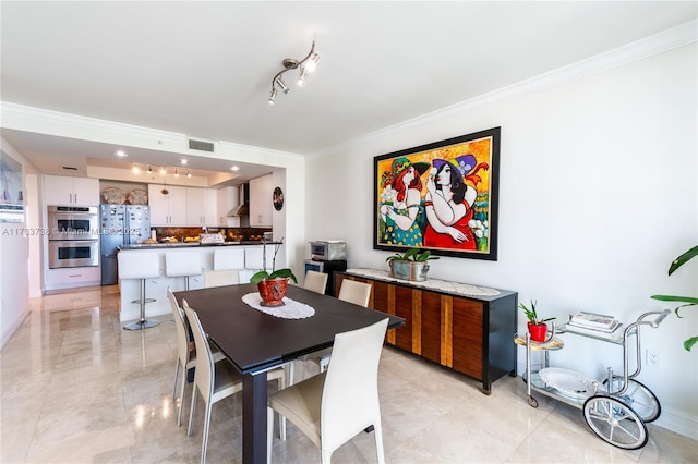 dining area featuring ornamental molding