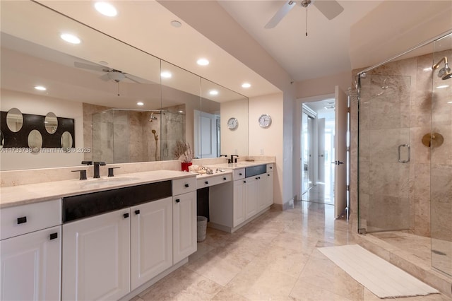 bathroom featuring vanity, ceiling fan, and walk in shower