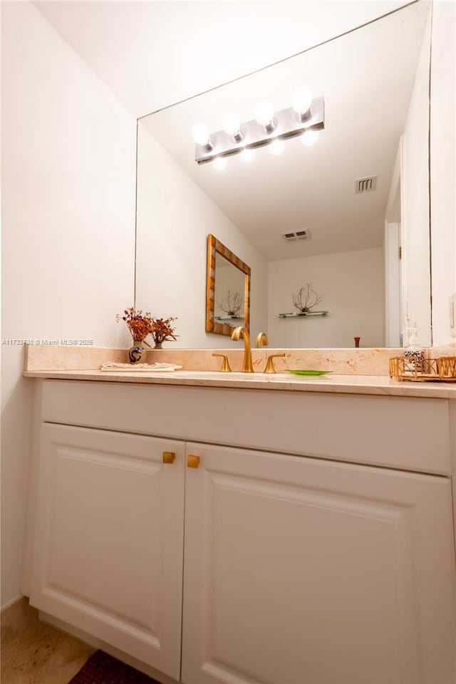 bathroom with tile patterned floors and vanity