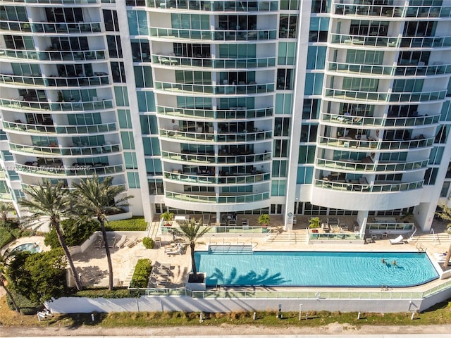 view of building exterior with a community pool