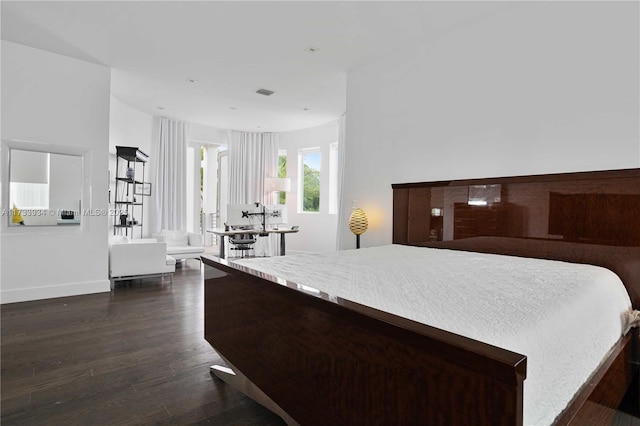 bedroom featuring dark hardwood / wood-style flooring