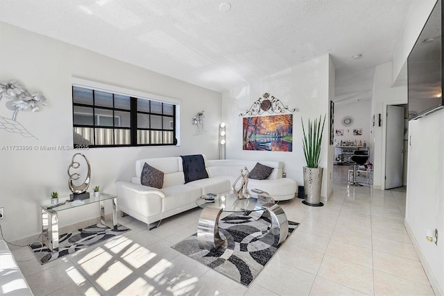 tiled living room with a textured ceiling