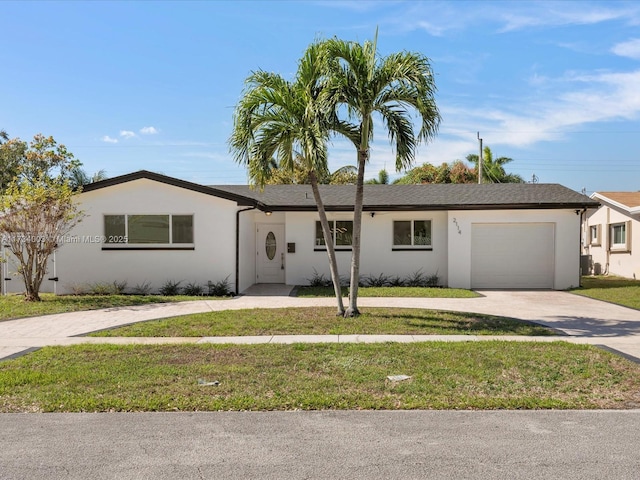 ranch-style house with a garage and a front lawn