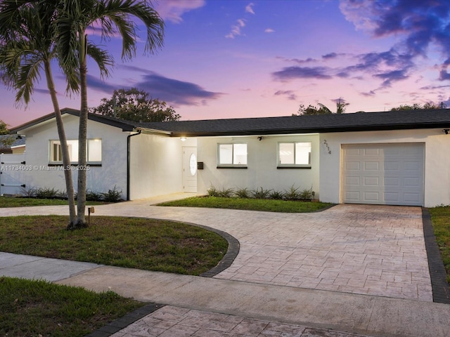 ranch-style house featuring a garage