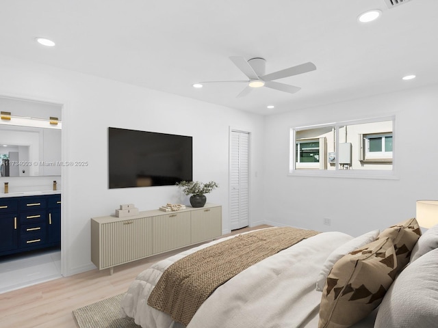 bedroom featuring ceiling fan and light hardwood / wood-style floors