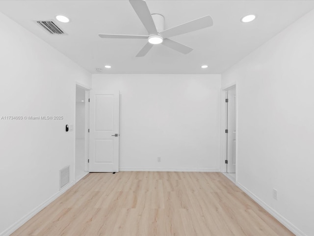 spare room with light hardwood / wood-style floors and ceiling fan