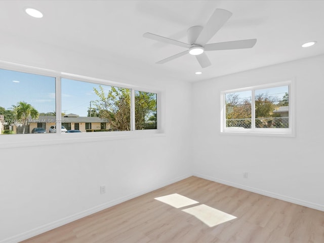 unfurnished room featuring light hardwood / wood-style flooring and ceiling fan