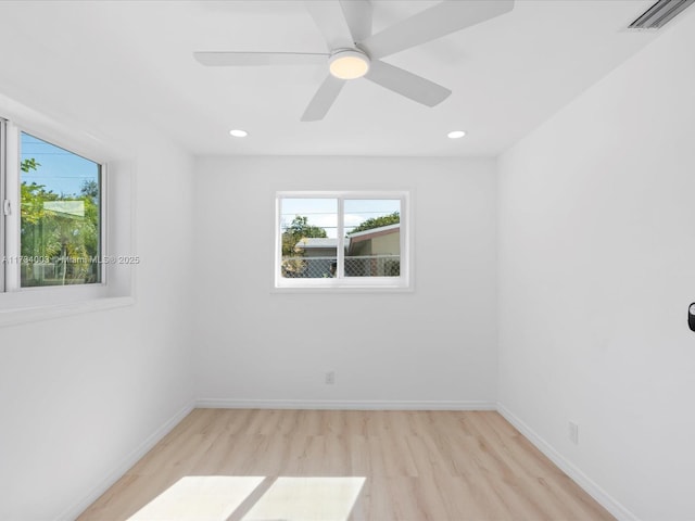 unfurnished room with ceiling fan and light hardwood / wood-style floors