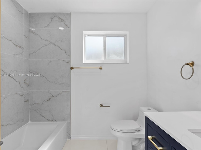 bathroom featuring vanity, tile patterned floors, and toilet