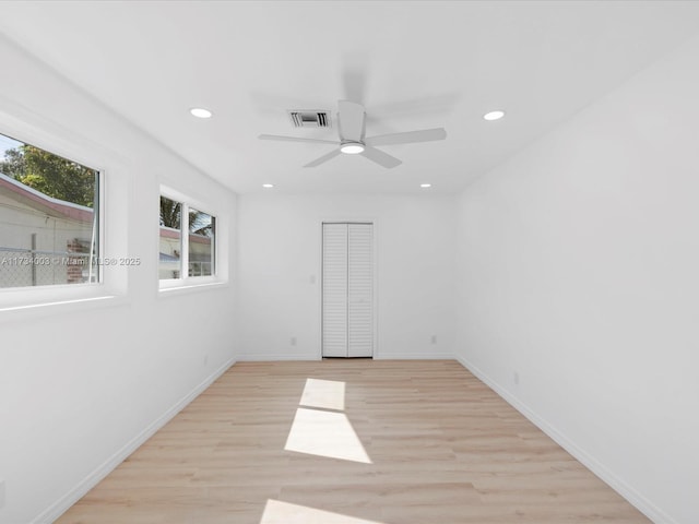 unfurnished room with ceiling fan and light hardwood / wood-style flooring