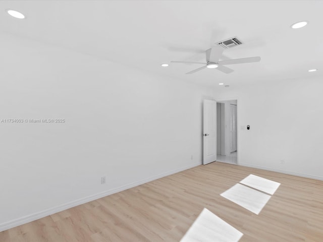 unfurnished room with ceiling fan and light hardwood / wood-style floors