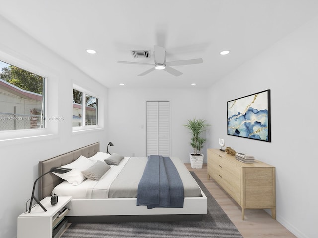 bedroom featuring hardwood / wood-style flooring and ceiling fan