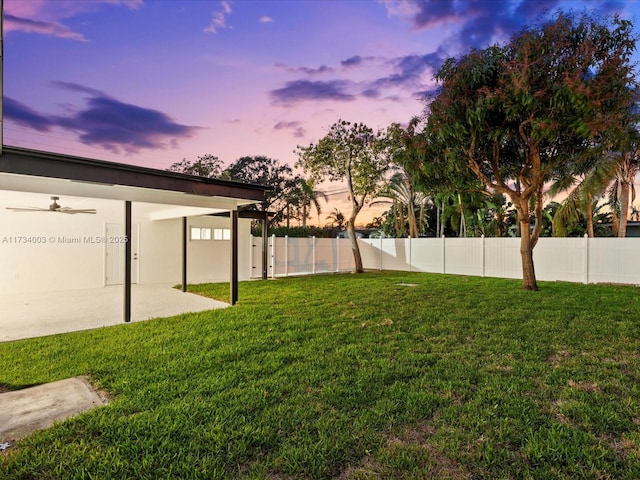 yard at dusk with a patio