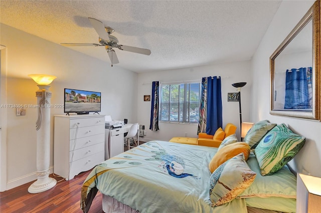 bedroom with wood-type flooring, a textured ceiling, and ceiling fan