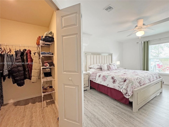 bedroom featuring light hardwood / wood-style floors and ceiling fan