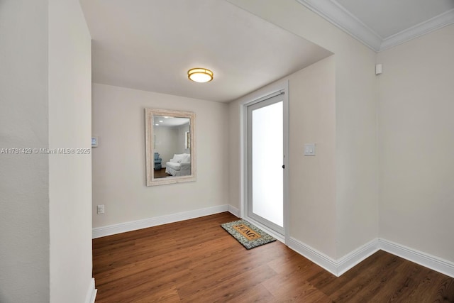 foyer featuring ornamental molding and wood-type flooring