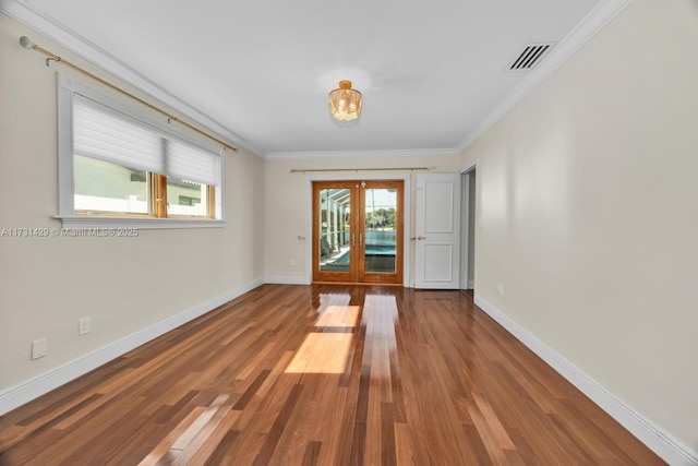 interior space with crown molding, wood-type flooring, and french doors