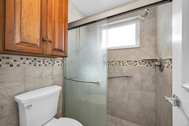 bathroom featuring walk in shower and toilet