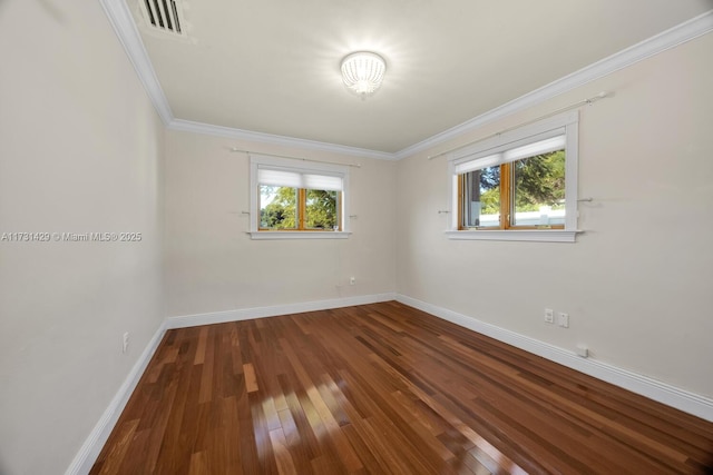 empty room with wood-type flooring and ornamental molding