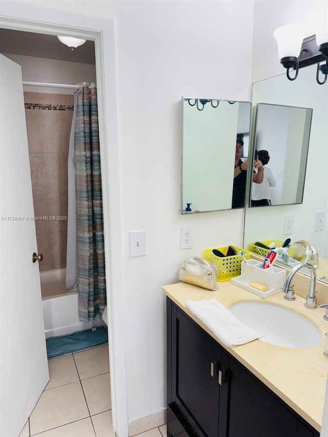 bathroom featuring tile patterned floors, vanity, and shower / bath combo