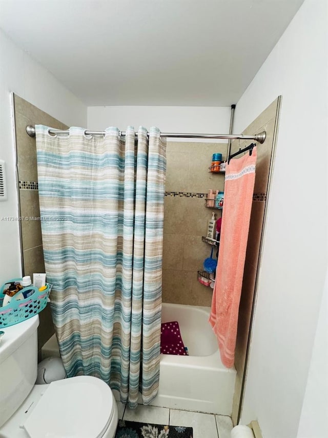 bathroom with shower / bathtub combination with curtain, tile patterned flooring, and toilet