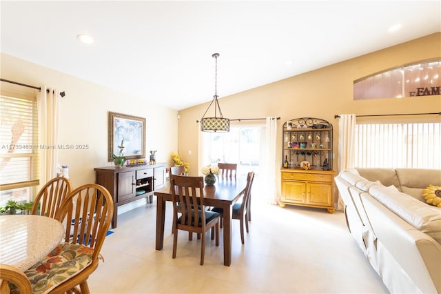 dining area featuring lofted ceiling and recessed lighting