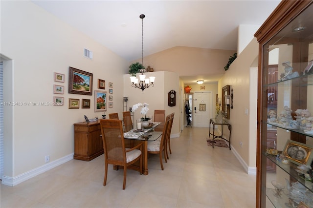 dining area featuring visible vents, vaulted ceiling, a notable chandelier, and baseboards