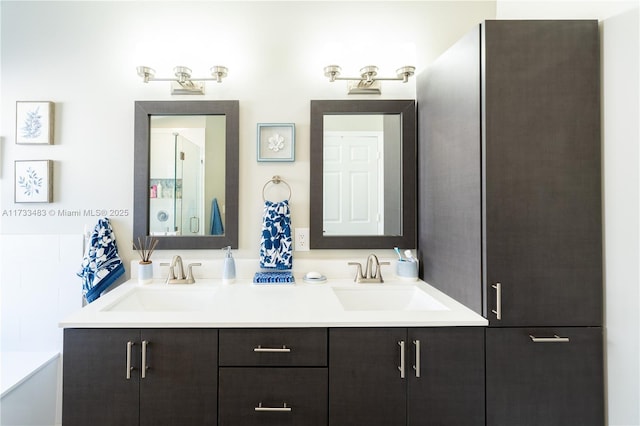 bathroom featuring double vanity and a sink