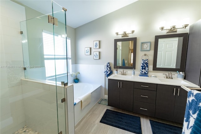 bathroom with lofted ceiling, a garden tub, a sink, and a shower stall