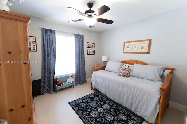 bedroom with light tile patterned floors, baseboards, and a ceiling fan