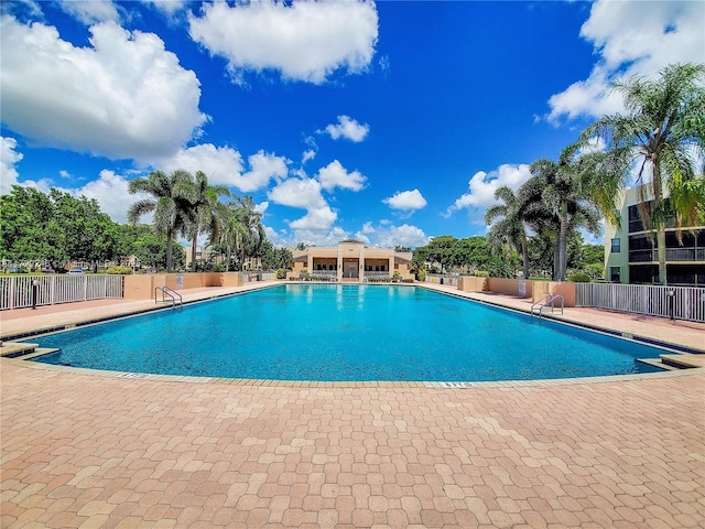 view of swimming pool featuring a patio