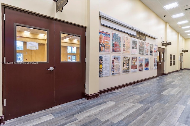 entryway with french doors and wood-type flooring