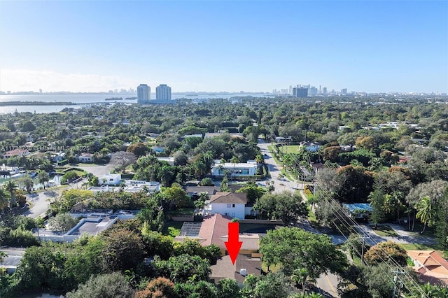 birds eye view of property featuring a water view and a city view