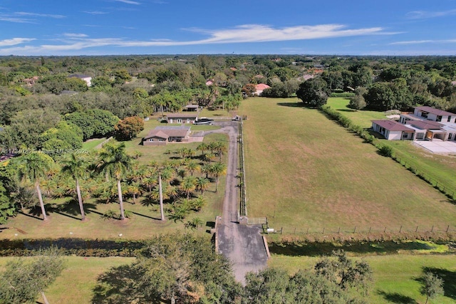 birds eye view of property with a rural view