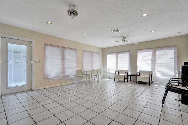 unfurnished room with recessed lighting, visible vents, a textured ceiling, and light tile patterned floors