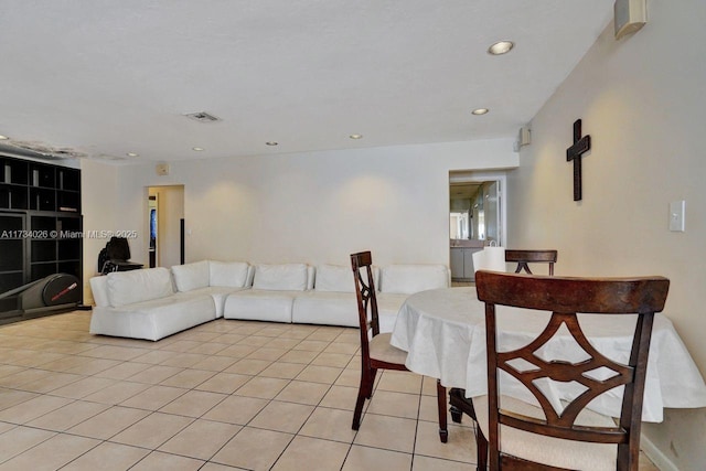 living area with recessed lighting, visible vents, and light tile patterned flooring