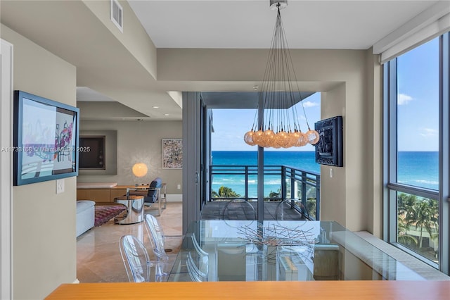 dining room with a water view